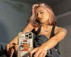 She is a tattoo freak and has several tattoos on her shoulders, back and other body parts.